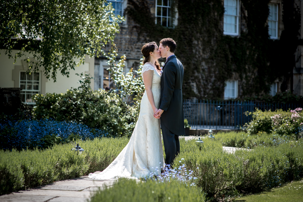 bride and groom in the garden of the royal crescent hotel