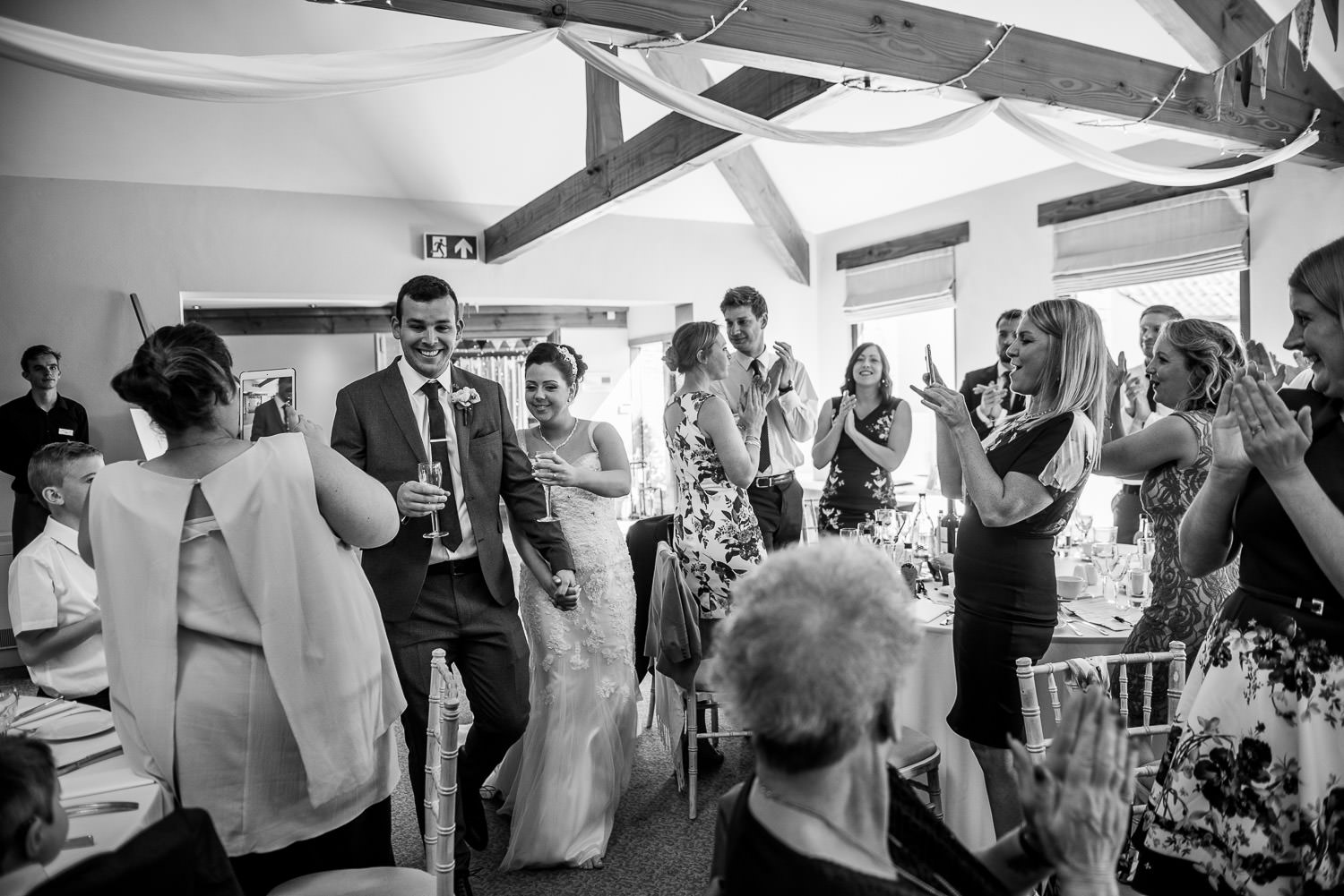 bride and groom entering the party