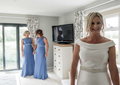 bridesmaids laughing while getting ready