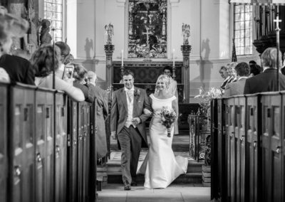 bride and groom walking down the aisle st michaels great badminton