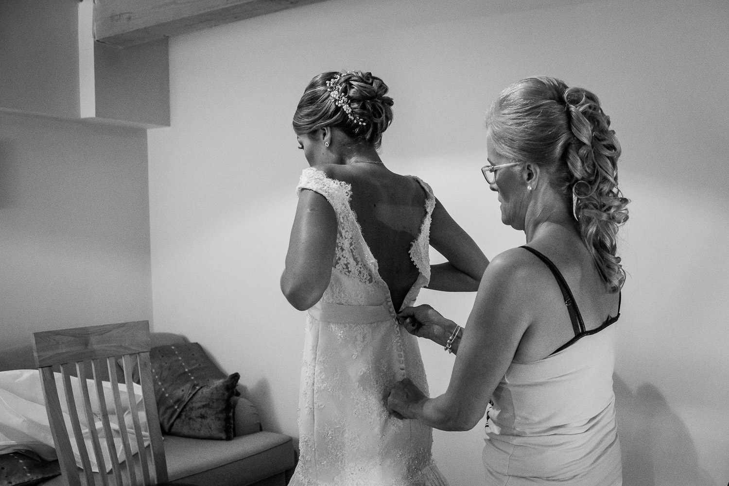 bride putting on her dress at folly farm wedding