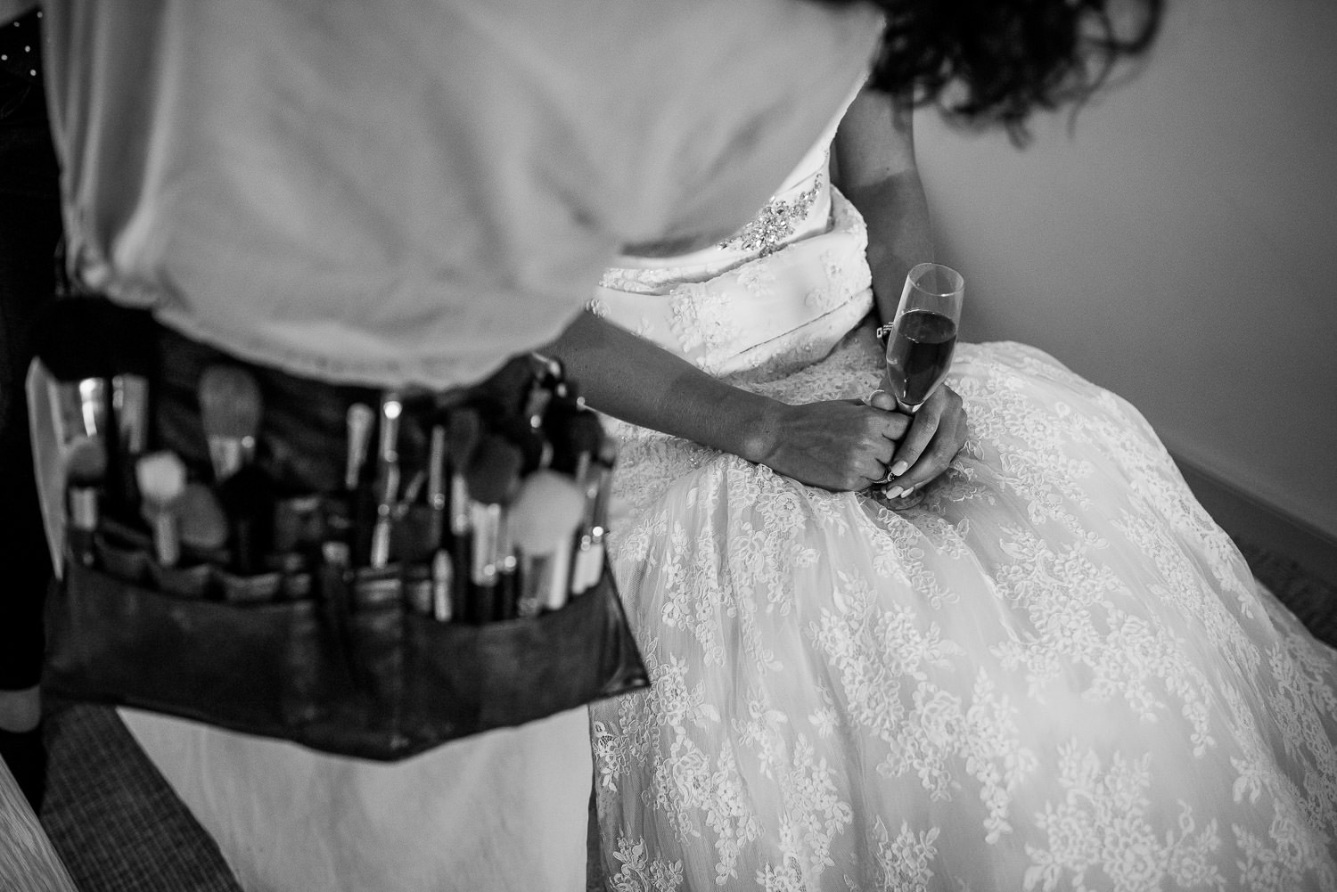 bride enjoying a drink during the preparations