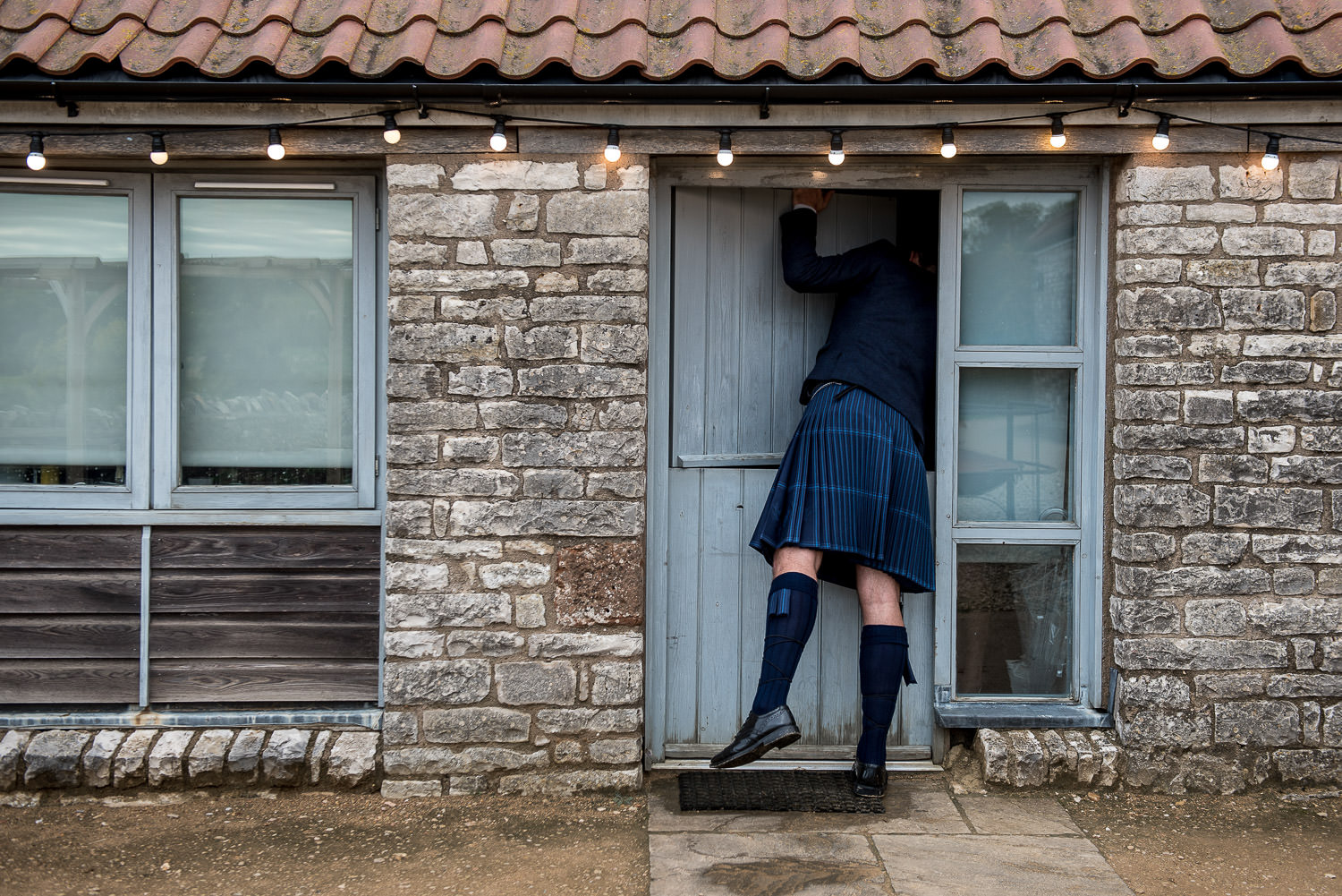 wedding guests looking into a door