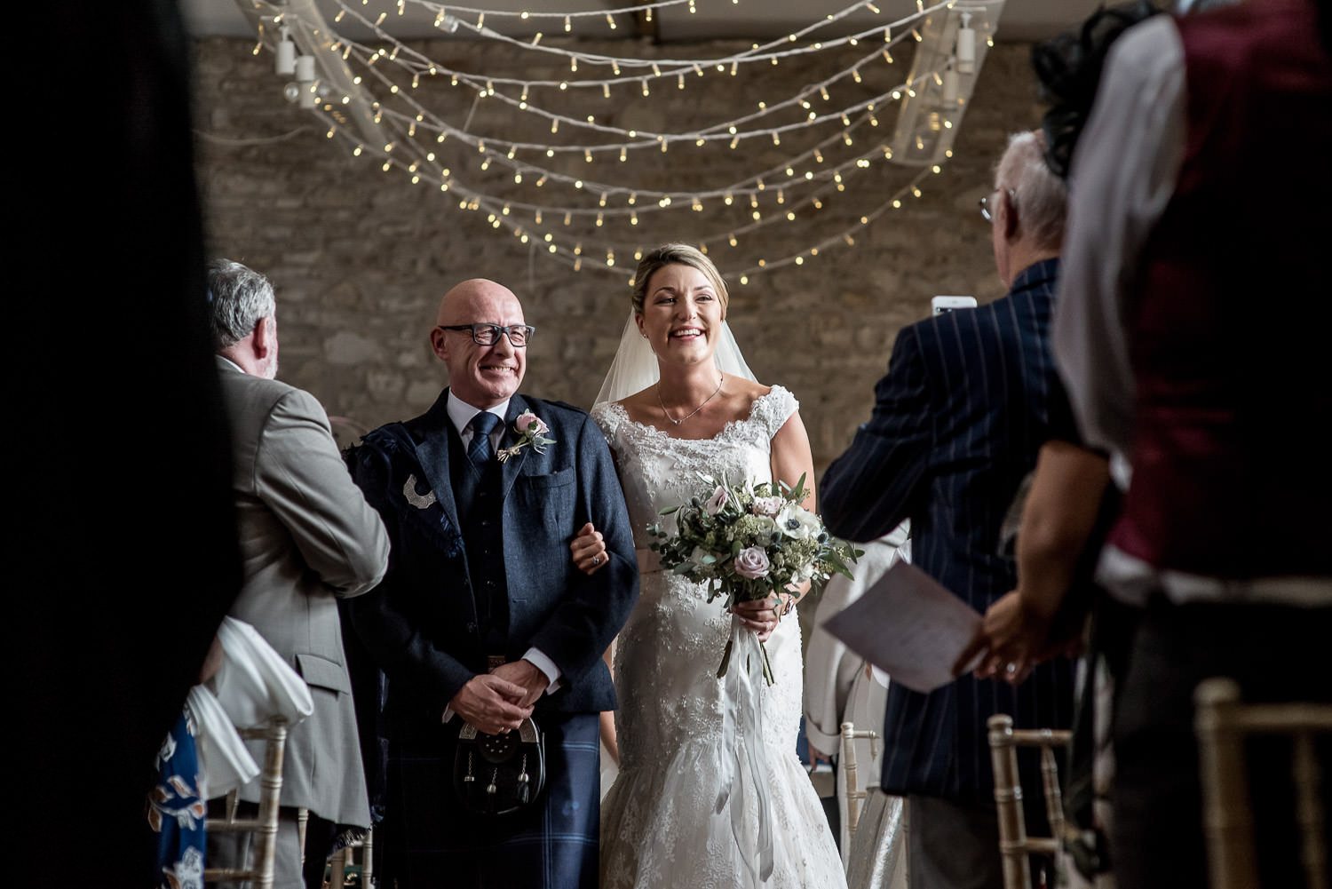 bride and groom walking down the aisle at folly farm centre