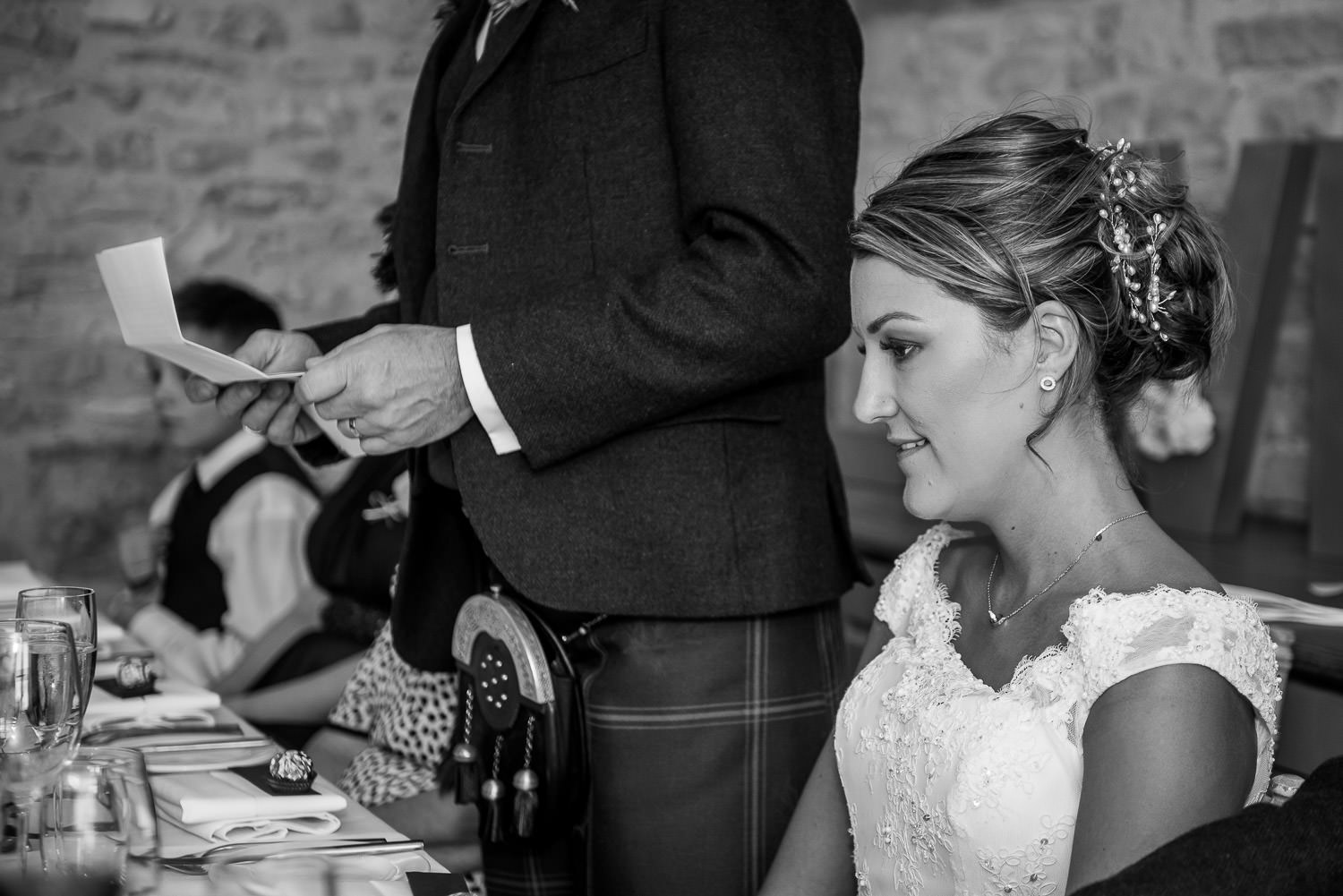 the bride's face during the groom's wedding speech