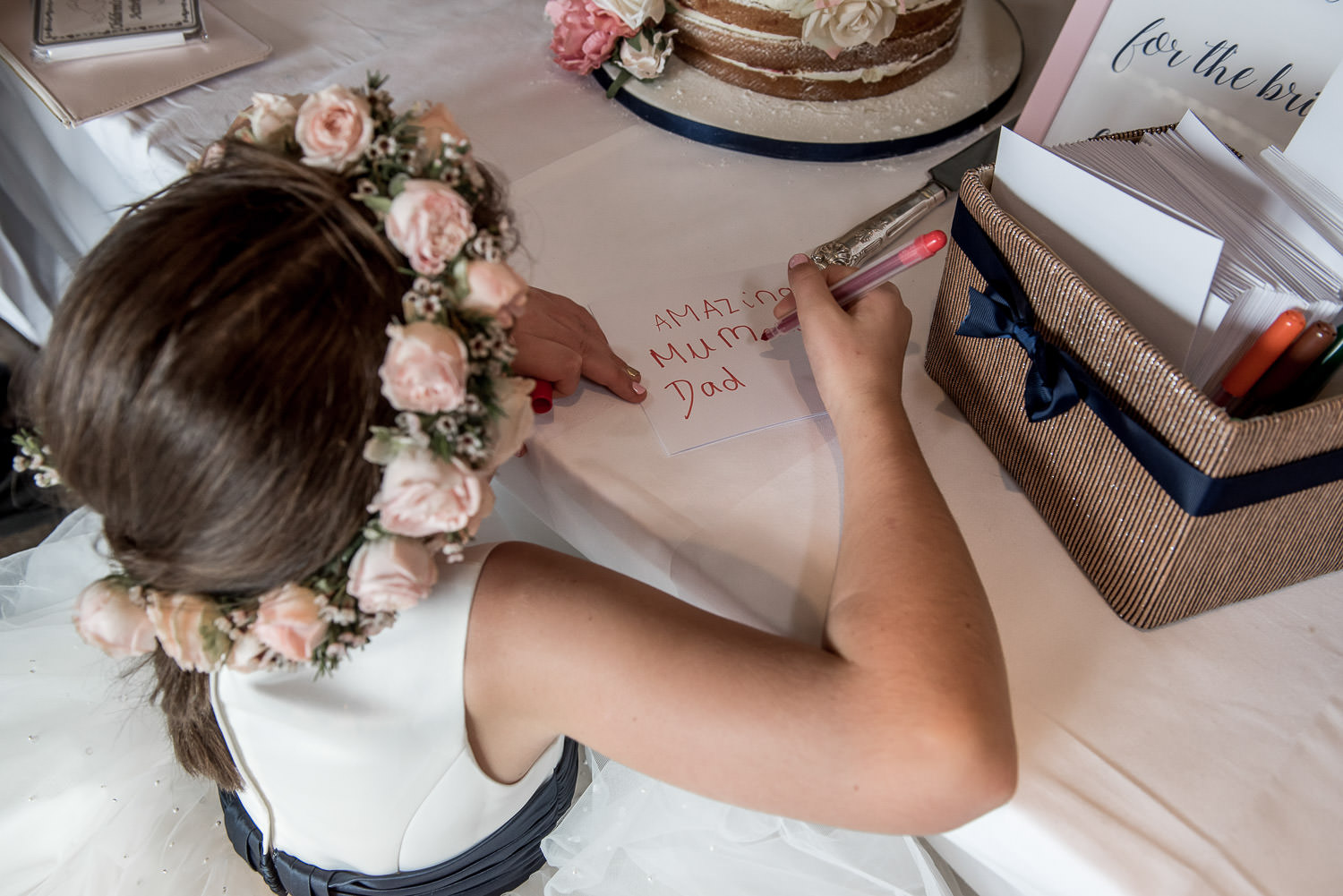 flower girl writing a love note