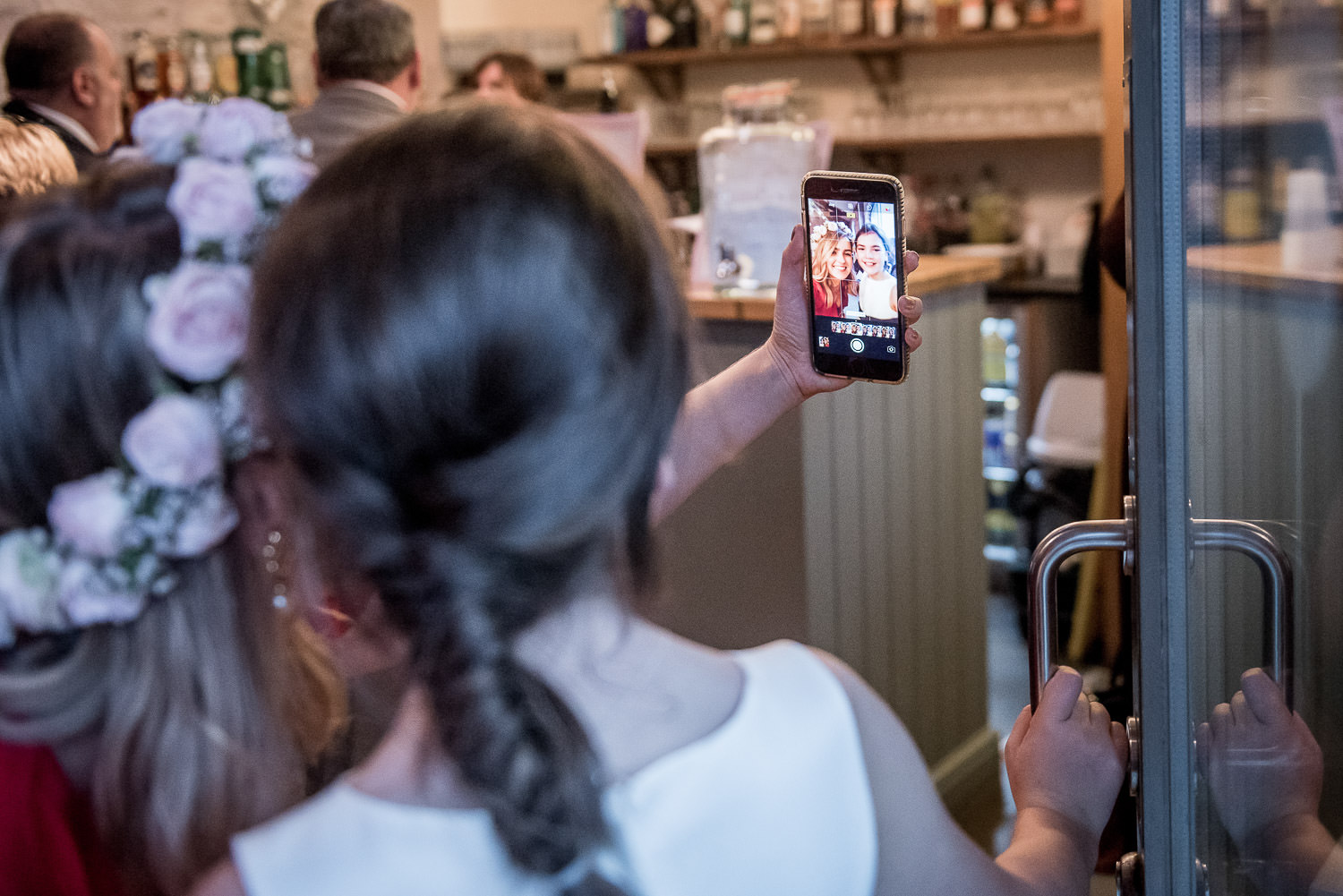 flower girls taking a selfie with a mobile phone