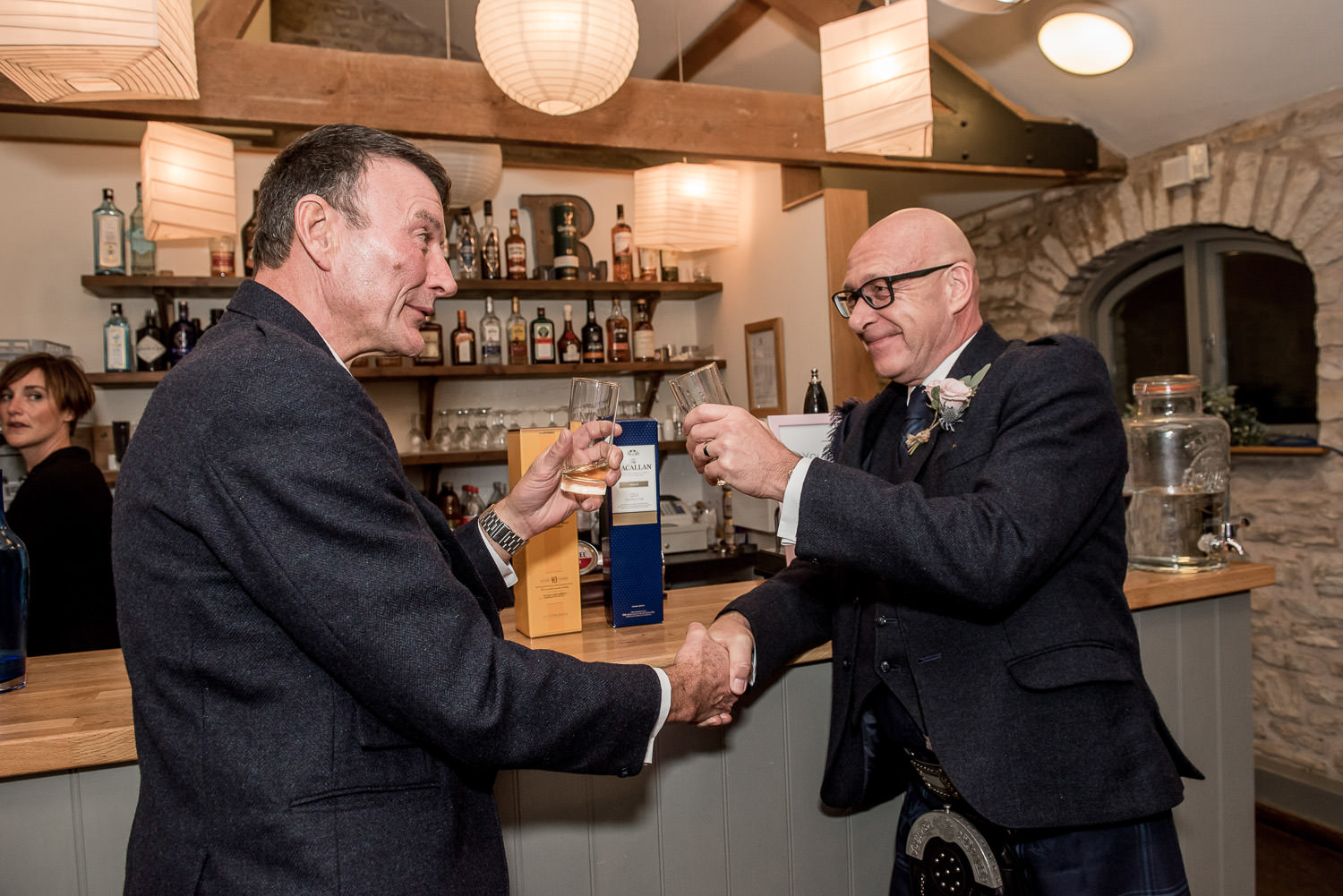 groom and father of the bride having a drink