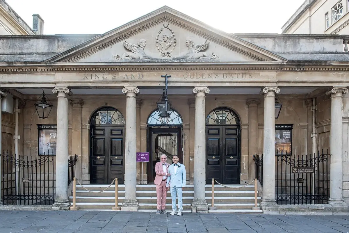 Male wedding couple in front of the Roman Baths in Bath Wedding Photographer