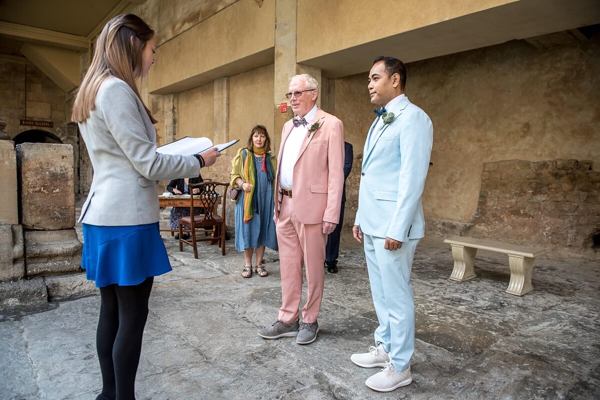 groom and groom at the roman baths wedding in bath