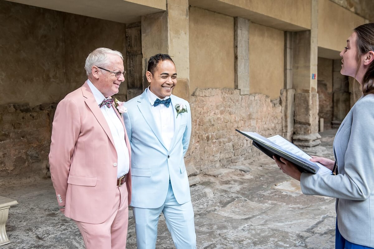 groom and groom at the roman baths wedding in bath