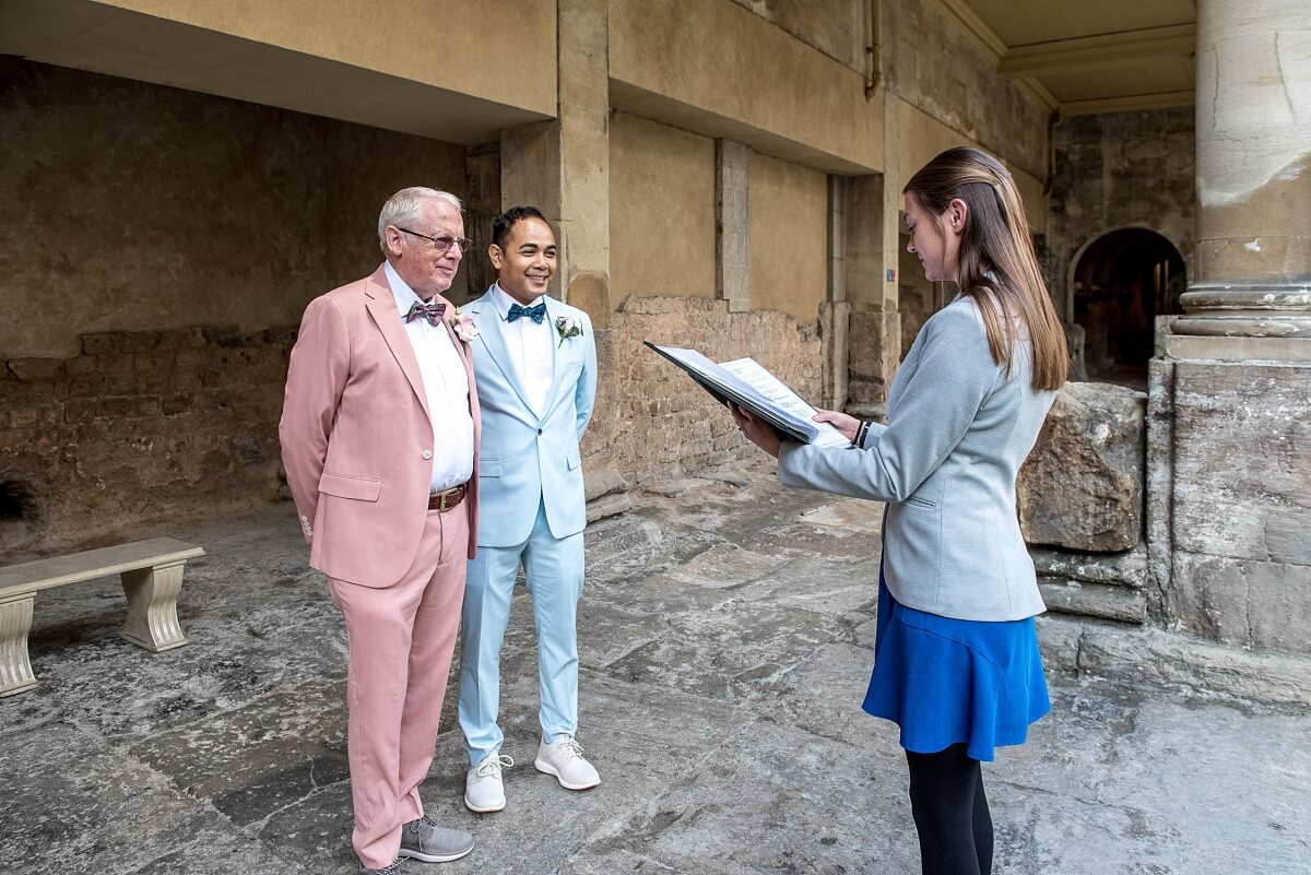 groom and groom at the roman baths wedding in bath