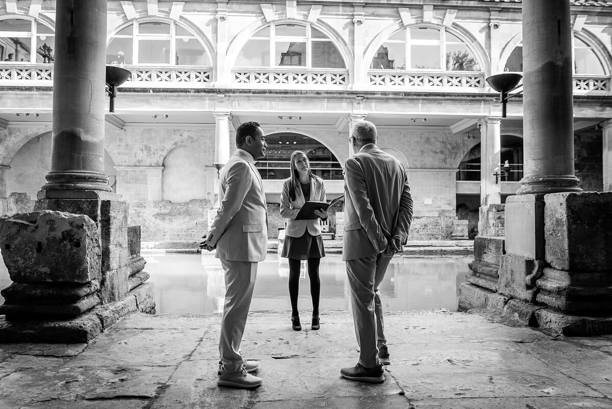 groom and groom at the roman baths wedding in bath