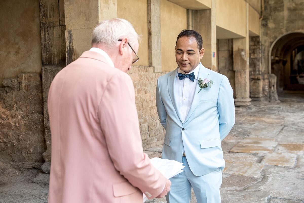 groom and groom at the roman baths wedding in bath