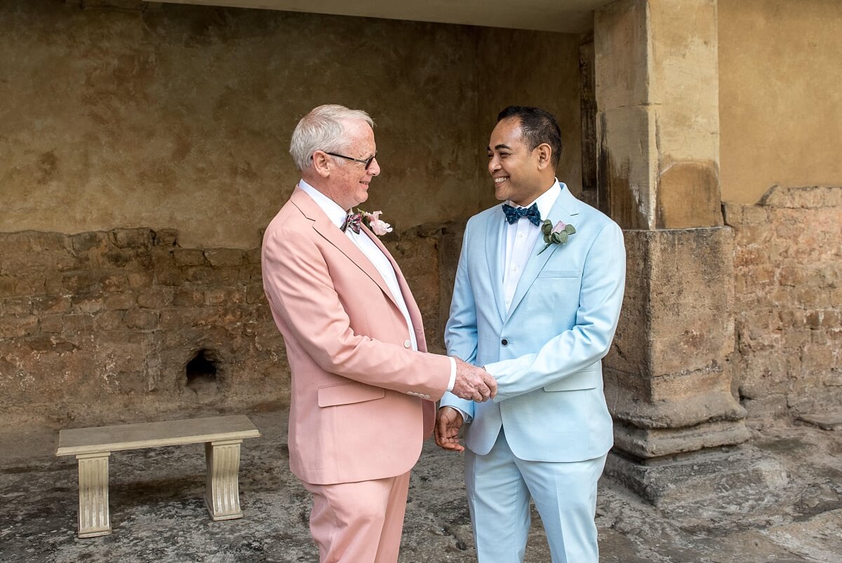 groom and groom at the roman baths wedding in bath