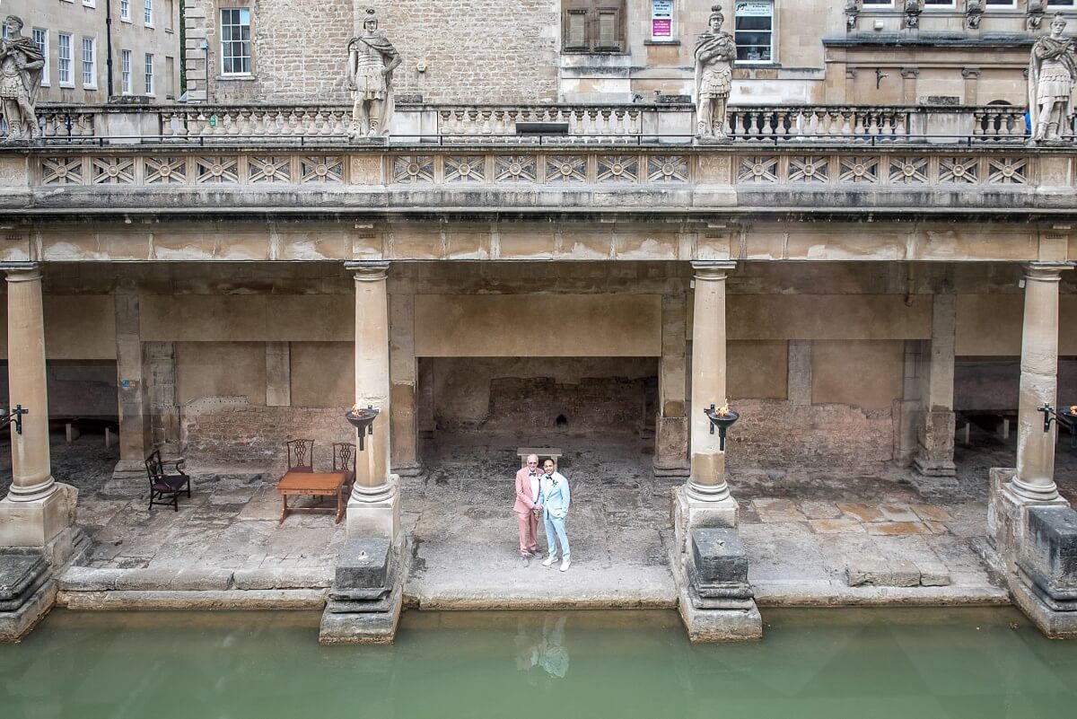 groom and groom at the roman baths wedding in bath