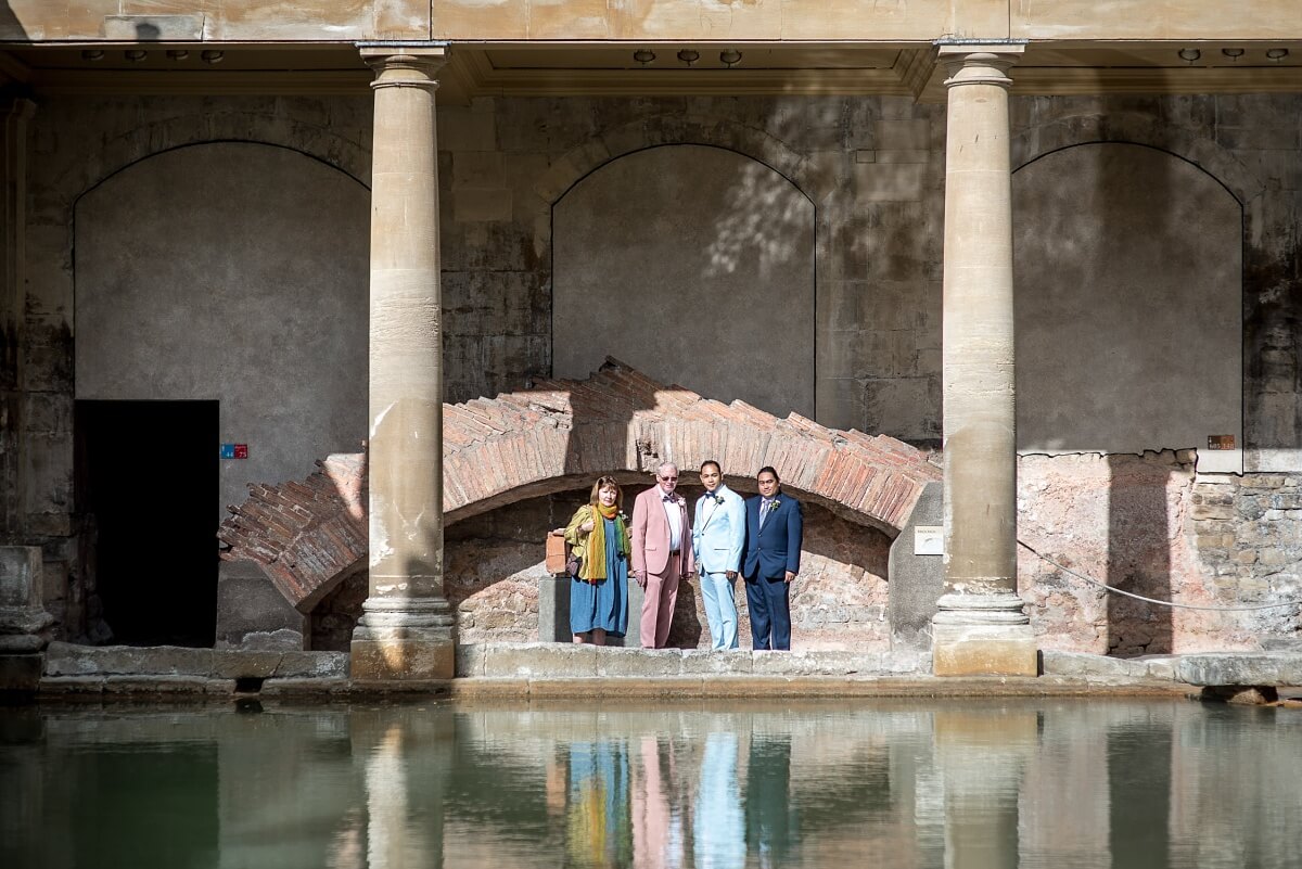 groom and groom at the roman baths wedding in bath