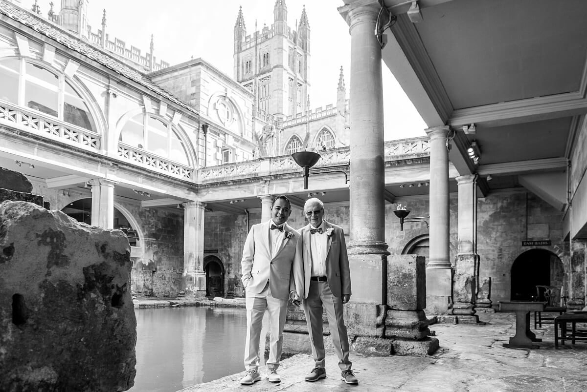 groom and groom at the roman baths wedding in bath