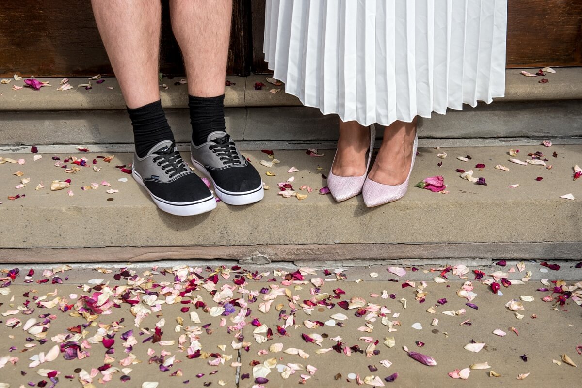 bride and groom's feet with confetti