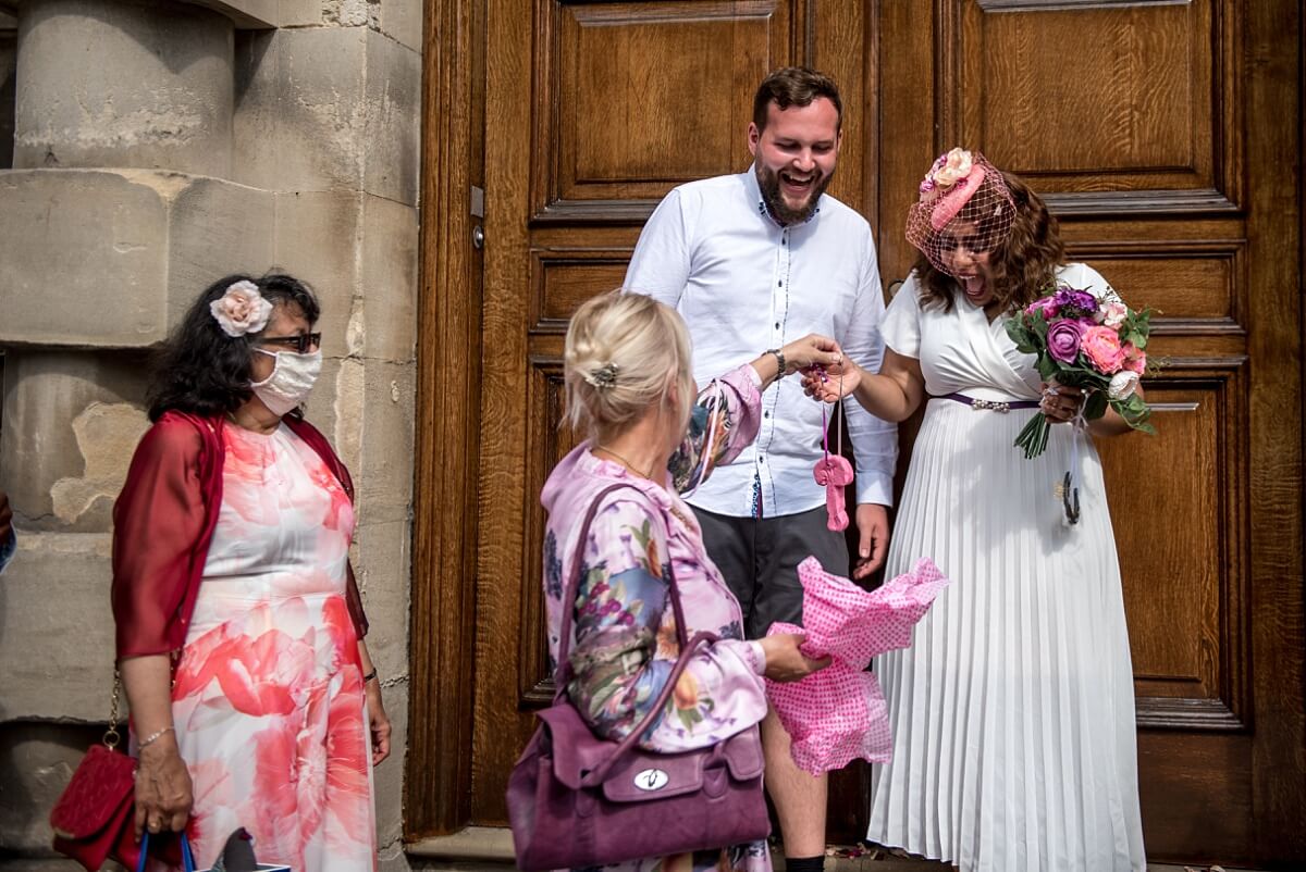 bride and groom with funny wedding present