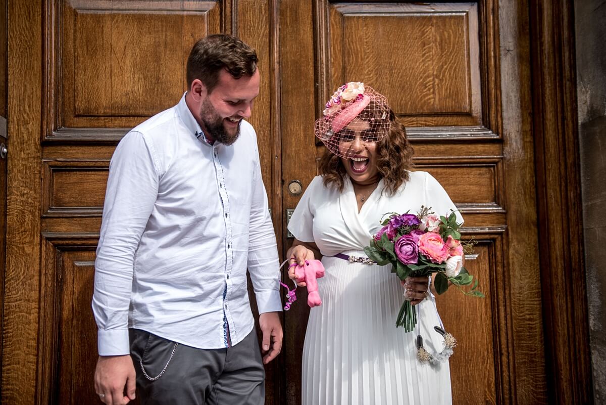 bride and groom with funny wedding present