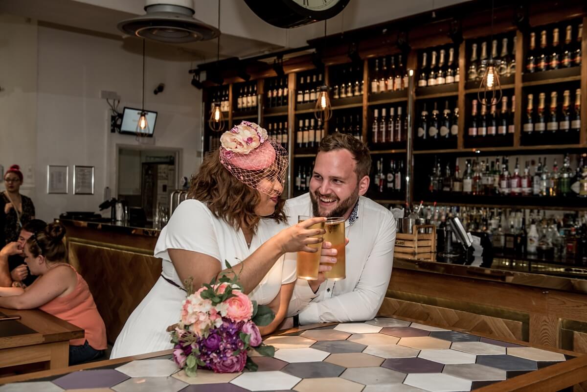 new bride and groom having a drink, bath wedding photography