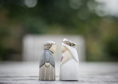 funny wedding cake toppers wearing the wedding rings